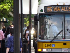 picture of people boarding the 66 bus